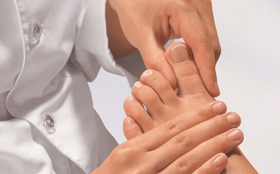 a specialist examines the feet for fungal infection